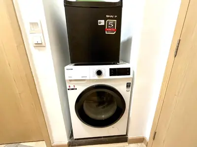 a washing machine with a box on top of it at The Luxe Infinity Skypool By Tasu Homes in Kuala Lumpur
