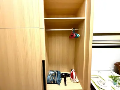 a cupboard with a purse and other items in it at The Luxe Infinity Skypool By Tasu Homes in Kuala Lumpur
