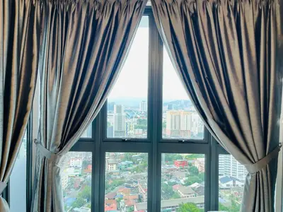 a window with a view of a city at The Luxe Infinity Skypool By Tasu Homes in Kuala Lumpur