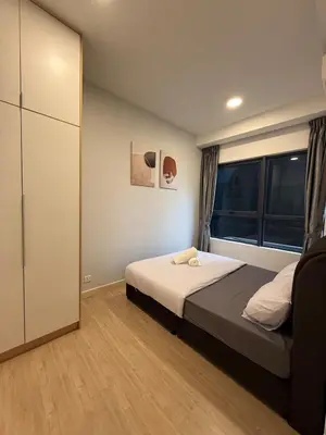 a bedroom with a bed and a large window at Luxury Affordable at Arte Plus 2BR Near KLCC with WiFi in Kuala Lumpur