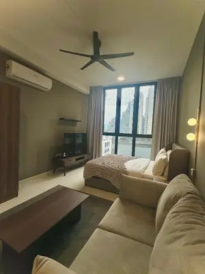 a bedroom with a bed and a ceiling fan at Majestic Residence KLCC By Alfa in Kuala Lumpur