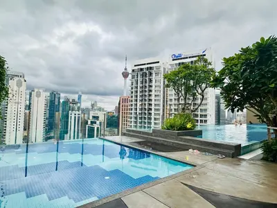 a swimming pool on the roof of a building at Majestic Residence KLCC By Alfa in Kuala Lumpur