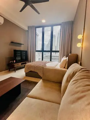 a bedroom with a couch and a bed and a large window at Majestic Residence KLCC By Alfa in Kuala Lumpur