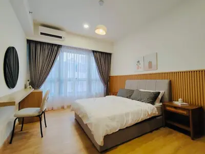 a bedroom with a bed and a desk and a desk at Agile Sky Pavilion Homestay Bukit Bintang KL in Kuala Lumpur