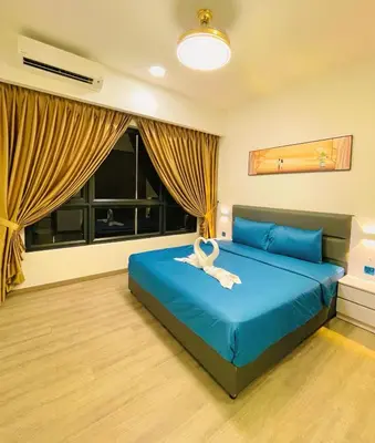 a bedroom with a blue bed with a white animal on it at Agile Sky Pavilion Homestay Bukit Bintang KL in Kuala Lumpur