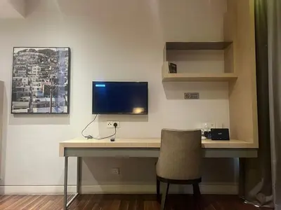 a desk with a computer monitor and a chair at D Majestic hosted by Super Tang in Kuala Lumpur