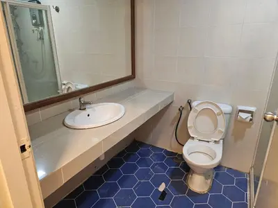 a bathroom with a toilet and a sink at CEMPAKA SUITES By VG Homes in Kuala Lumpur
