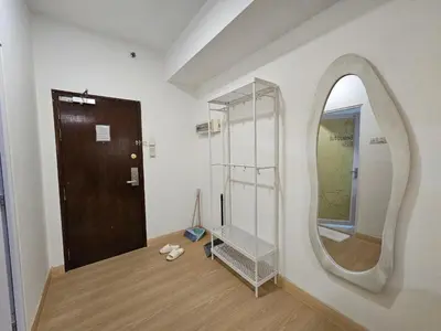 a room with a mirror and a wooden door at CEMPAKA SUITES By VG Homes in Kuala Lumpur