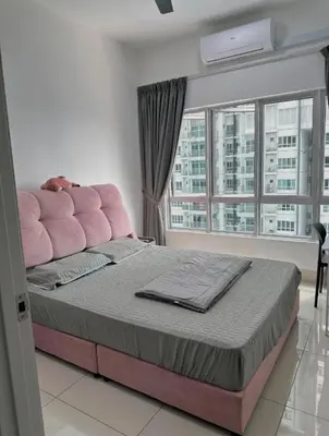 a bedroom with a pink bed with a large window at ESU Home Ventures in Kuala Lumpur