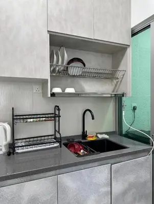 a kitchen with a sink and a counter top at ESU Home Ventures in Kuala Lumpur