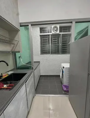 a small kitchen with a sink and a window at ESU Home Ventures in Kuala Lumpur