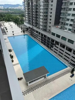 an overhead view of a large swimming pool on a building at ESU Home Ventures in Kuala Lumpur