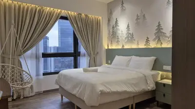 a bedroom with a large bed and a window at Nature Home Agile Bukit Bintang TRX Pavillion Nice View Free Netflix #3 in Kuala Lumpur
