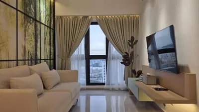 a living room with a couch and a large window at Nature Home Agile Bukit Bintang TRX Pavillion Nice View Free Netflix #3 in Kuala Lumpur