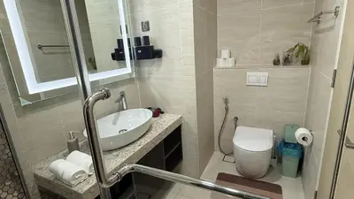 a bathroom with a sink and a toilet at Star Residance KLCC by Nexus 13 in Kuala Lumpur