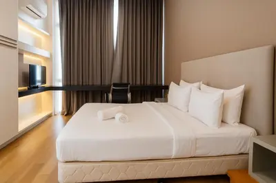 a hotel room with a bed and a television at The Platinum Kuala Lumpur by MAHA in Kuala Lumpur