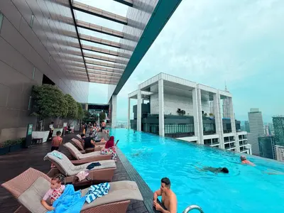 a pool on top of a building with people in it at The Platinum Kuala Lumpur by MAHA in Kuala Lumpur