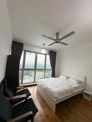 a bedroom with a bed and a ceiling fan at The regalia KLCC panorama view in Kuala Lumpur