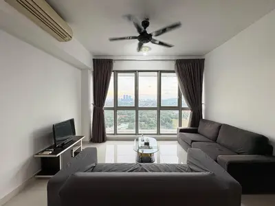 a living room with a couch and a ceiling fan at The regalia KLCC panorama view in Kuala Lumpur