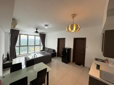 a living room with a couch and a table at The regalia KLCC panorama view in Kuala Lumpur