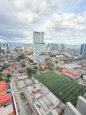 an aerial view of a city with a soccer field at Colony Suites KL by Sopping Centre in Kuala Lumpur