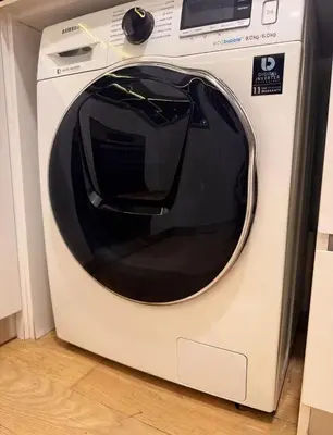 a white washing machine with a window on it at luxury One Bedroom KLCC in Kuala Lumpur