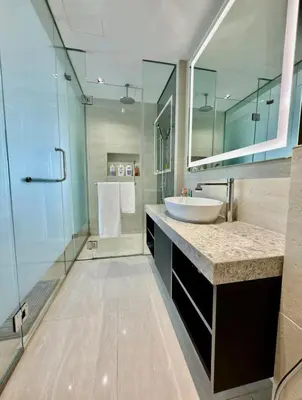 a bathroom with a sink and a glass shower at luxury One Bedroom KLCC in Kuala Lumpur