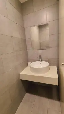 a white bathroom with a sink and a mirror at ARTE Mont Kiara Modern Sanctuary Jacuzzi in Kuala Lumpur