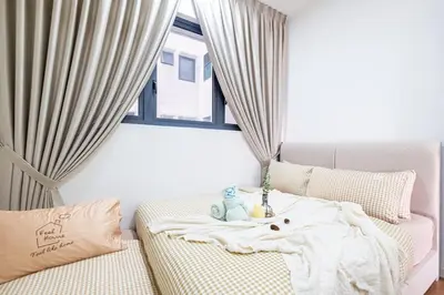 a living room with a couch and a window at Cozy Home to explore KL City KLCC TRX Bkt Bintang in Kuala Lumpur