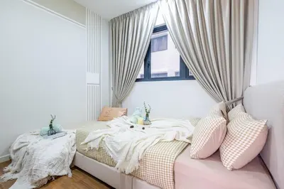 a bedroom with two beds and a window at Cozy Home to explore KL City KLCC TRX Bkt Bintang in Kuala Lumpur