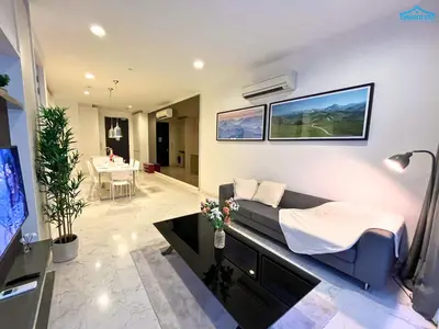 a living room with a couch and a tv at Platinum Suites KLCC by Dream'Inn in Kuala Lumpur