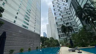 a view of a city with a building and a pool at 3-10mins to klcc -pavilion -premium studio 2-4pax in Kuala Lumpur