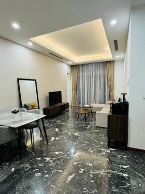 a living room with a couch and a table at Royce Residence KLCC by ABM Unique in Kuala Lumpur