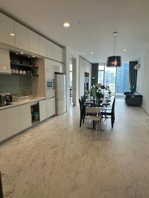 a kitchen and dining room with a table and chairs at The Platinum Galaxy Suites KLCC in Kuala Lumpur
