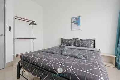 a bedroom with a bed with a teddy bear on it at Chan Sow Lin - Cozy 3B3B - 6 pax - F&B & Mart in Kuala Lumpur