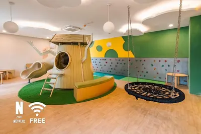 a childrens play room with a slide and a playground at Elegant 2BR Residence at MET 1 in Kuala Lumpur