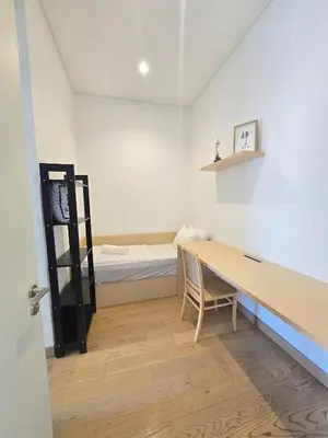 a room with a desk and a bed in a room at Lucentia Suties Rooftop pool by Lalaport KL in Kuala Lumpur