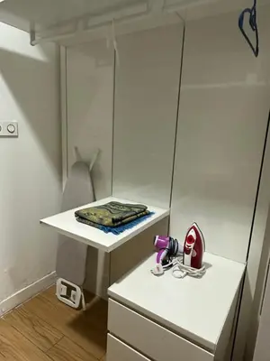 a small room with a table and a mirror at Global Suites at Platinum kLCC in Kuala Lumpur
