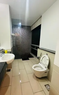 a bathroom with a toilet and a sink at Swiss Garden Resident By FA in Kuala Lumpur