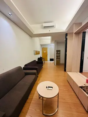 a living room with a couch and a table at Swiss Garden Resident By FA in Kuala Lumpur