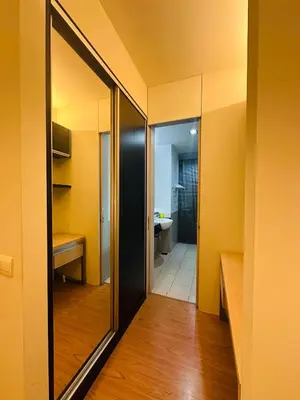 a hallway with a mirror and a bathroom at Swiss Garden Resident By FA in Kuala Lumpur
