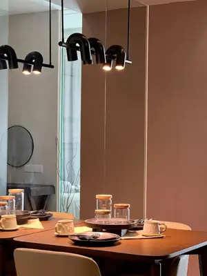 a dining room table with chairs and a large mirror at Dorsett Hartamas - Luxury Studio with Bathtub in Kuala Lumpur
