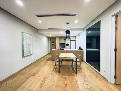 a dining room with a table and a kitchen at 188 suites Apartment with KLCC View by Vho'Z in Kuala Lumpur