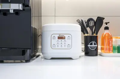 a white toaster sitting on a counter next to a microwave at Majestic Residence near KLCC Quill City 1 in Kuala Lumpur