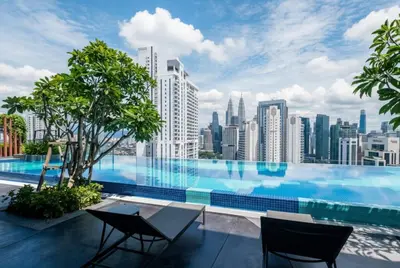 a swimming pool with a view of a city skyline at Majestic Residence near KLCC Quill City 1 in Kuala Lumpur