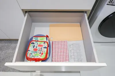 a white drawer with a box and other items in it at Majestic Residence near KLCC Quill City 2 in Kuala Lumpur