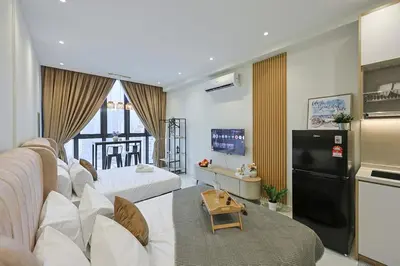 a living room with two beds and a refrigerator at Majestic Residence near KLCC Quill City 2 in Kuala Lumpur