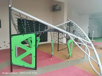 a spiral staircase with a green and white railing at Majestic Residence near KLCC Quill City 2 in Kuala Lumpur