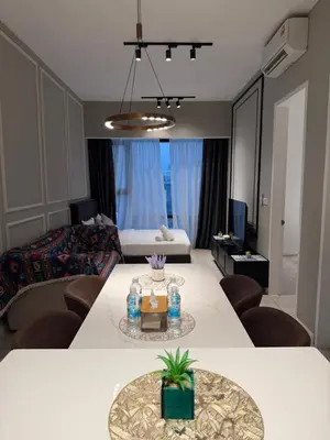 a living room with a table and a couch at Akson Residensi Axon Bukit Bintang by TaheeenS in Kuala Lumpur