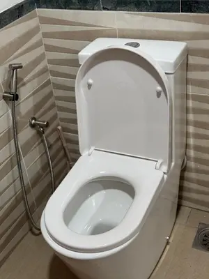a bathroom with a white toilet in a stall at Services Star Apartment At Times Square KL in Kuala Lumpur
